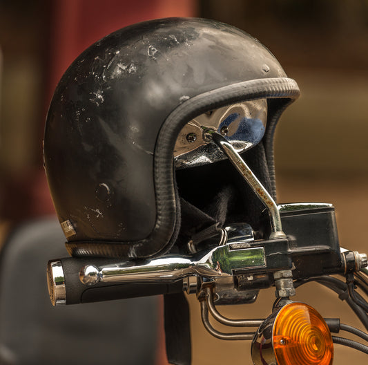 What makes motorcycle helmets effective against injury?